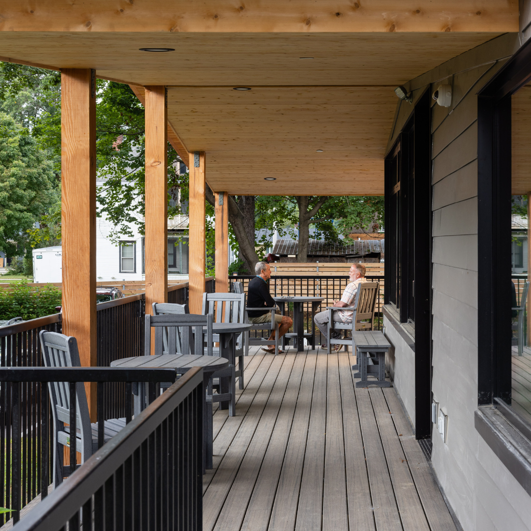 image of two people enjoying coffee on the Marsh House deck